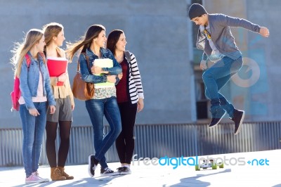 A Group Of Friends Having Fun With Skate In The Street Stock Photo