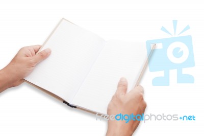 A Hand Is Opening Blank Page Notebook Stock Photo