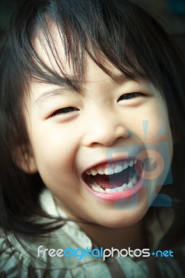 A Happy Little Girl Stock Photo
