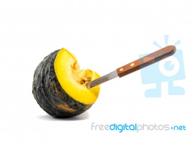A Knife Stab Equal Part Pumpkin On White Background Stock Photo