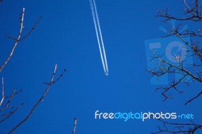A Long Trail Of Jet Plane On Blue Sky Stock Photo A Long Trail Of Jet Plane On Blue Sky Stock Photo