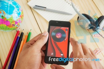 A Man Hand Holding Screen Shot Of Mobile Stock Photo