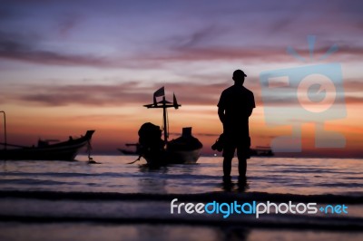 A Man Seeing The Beautiful Twilight Sunset Sky Stock Photo