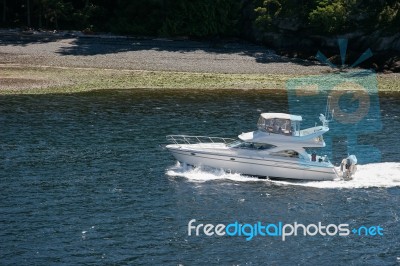 A Motorboat Rapidly Crossing The Straits Between Victoria (vanco… Stock Photo