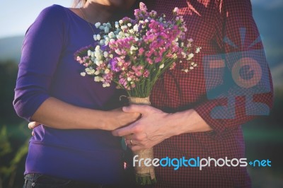 A Romantic Couple Holding Valentines Gift And Flowers, Vintage T… Stock Photo