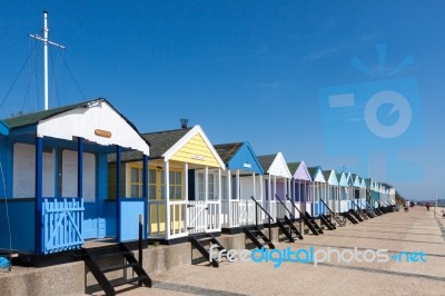 A Row Of Brightly Coloured Beach Huts In Southwold Suffolk Stock Photo