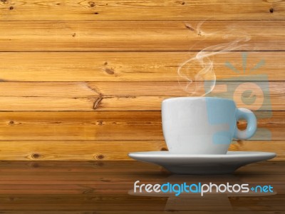 A White Cup Of Coffee On Wood Table Stock Photo
