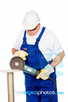 A Worker Grinding A Chunk Of Iron Stock Photo