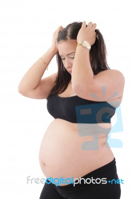 A Young Pregnant Woman Is Experiencing The Discomfort Of Pregnan… Stock Photo