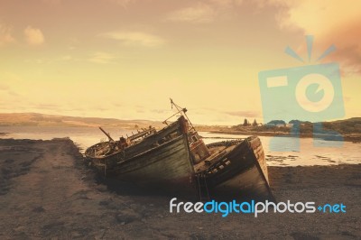 Abandoned Boats On The Beach Stock Photo
