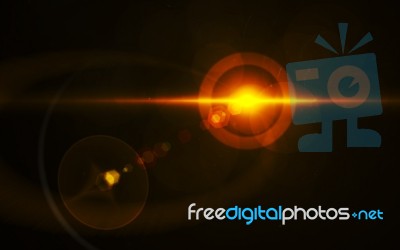Abstract Burst Lens Flare Over Black Background Stock Image