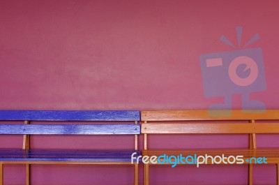 Abstract Colorful Long Bench On Vivid Pink Color Wall Stock Photo