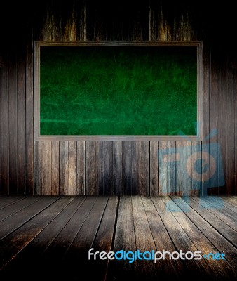 Abstract The Green Blackboard On Grunge Wall Stock Photo