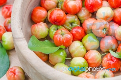 Acerola Cherry In Wood Bowl Stock Photo