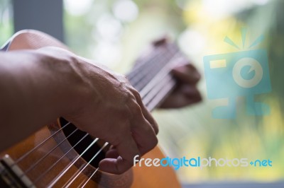 Acoustic Guitar Guitarist Playing. Musical Instrument With Perfo… Stock Photo