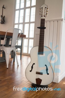 Acoustic Guitar In The Room Stock Photo