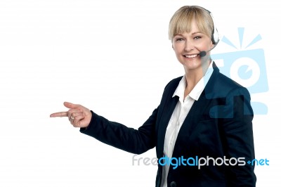 Active Employee Pointing Towards The Copy Space Area Stock Photo
