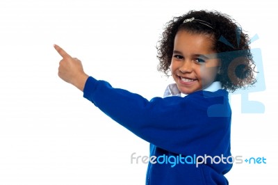 Adorable African Kid Pointing At Copy Space Area Stock Photo