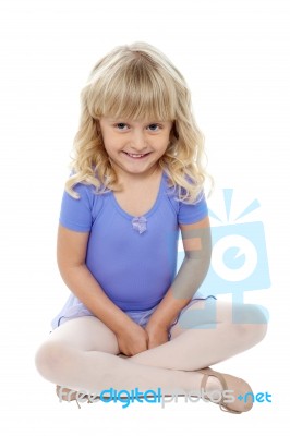 Adorable Kid Sitting With Crossed Legs On The Floor Stock Photo Adorable Kid Sitting With Crossed Legs On The Floor Stock Photo