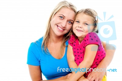 Adorable Mom And Daughter Posing Together Stock Photo