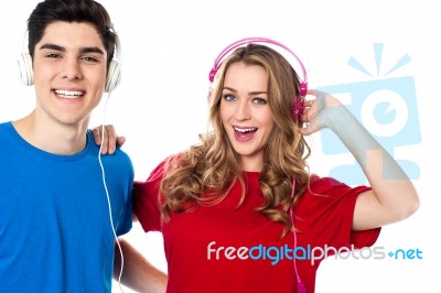 Adorable Young Couple Enjoying Music Stock Photo