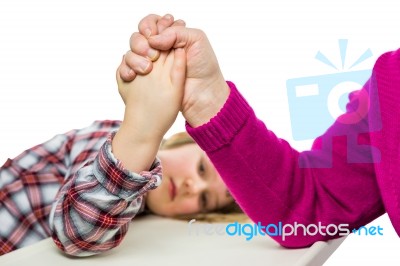 Adult Arm Wrestling With Young Girl Stock Photo