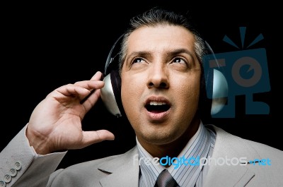 Adult Businessman Listening Music Stock Photo