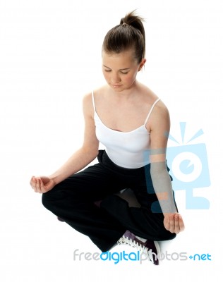 Aerial View Of Meditating Girl Stock Photo