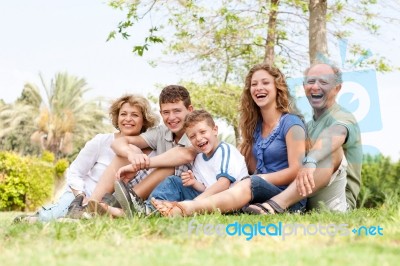 Affectionate Family Having Fun Outdoors Stock Photo