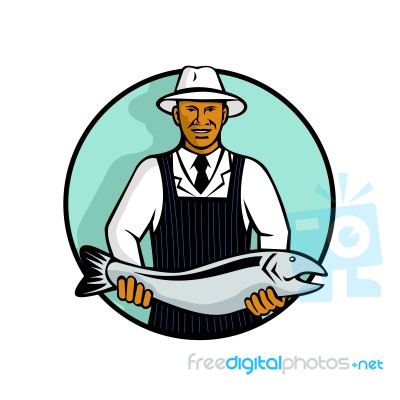African American Fishmonger Holding Trout Stock Image