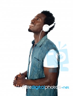 African guy Listening Music Stock Photo