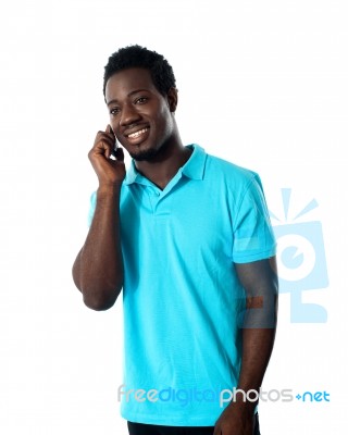African Guy Talking Over Phone Stock Photo