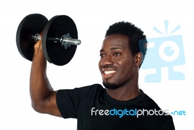 African Man Lifting Dumbbell Stock Photo