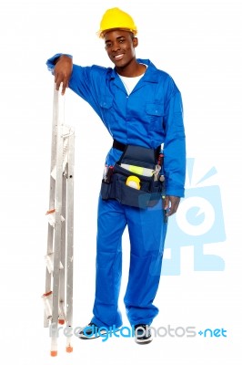 African Worker With Step Ladder Stock Photo