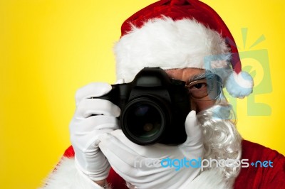 Aged Santa Adjusting Camera Lens Before Click Stock Photo