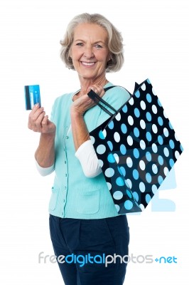 Aged Woman Displaying Her Cash Card Stock Photo