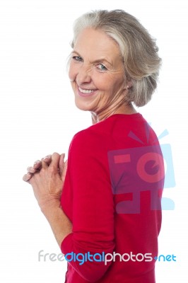 Aged Woman Looking Over Her Shoulders Stock Photo