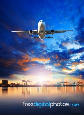 Air Cargo Plane Flying Over Ship In Harbor Port Use For Freight ,logistic And Import - Export Comercial Business Industry Stock Photo