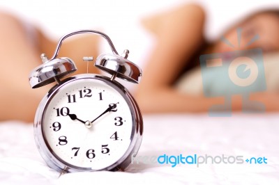 Alarm Clock And Woman Stock Photo