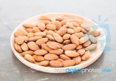 Almond Nuts On Wooden Plate Stock Photo Almond Nuts On Wooden Plate Stock Photo