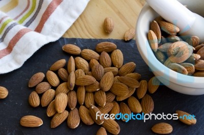 Almonds With A Mortar & Pestle Stock Photo