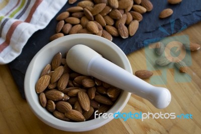 Almonds With A Mortar & Pestle Stock Photo