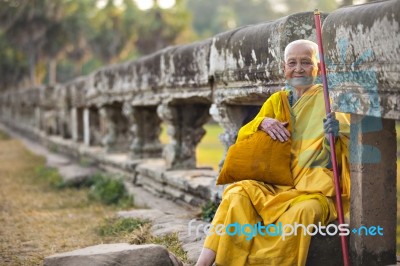 An Unidentified Old Buddhist Female Monk Dressed In Orange Toga Stock Photo
