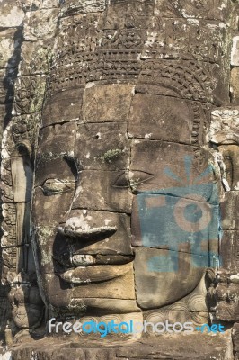 Ancient Stone Faces Of King Jayavarman Vii At The Bayon Temple, Stock Photo