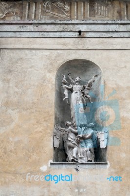 Angels And Babies Statue On The Facade Of The Collegiate Church Stock Photo