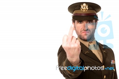 Angry Army Man Showing Middle Finger Stock Photo