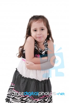 Angry Little Girl In Dress With Arms Crossed On White Background… Stock Photo