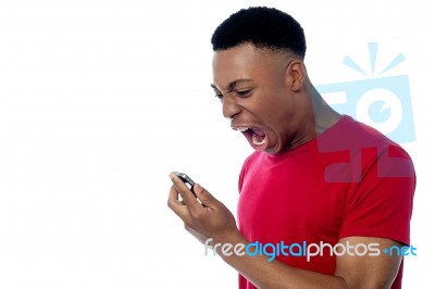 Angry Young Man Yelling Stock Photo