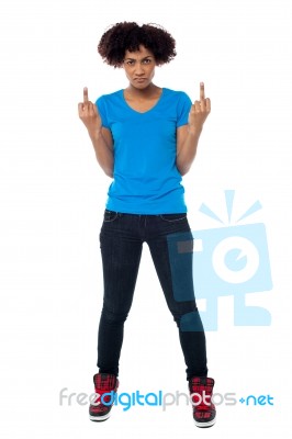 Annoyed Young Female Showing Middle Finger Stock Photo