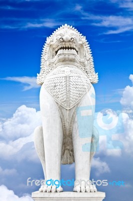 Antique Guardian Lion Sculpture On Blue Sky Background Stock Photo